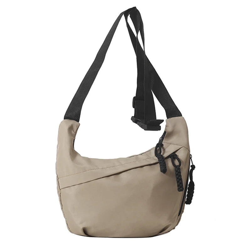 Neutral style tote bag with strap for carrying fitness items. New mini street-style handbag with shoulder strap. Lightweight and